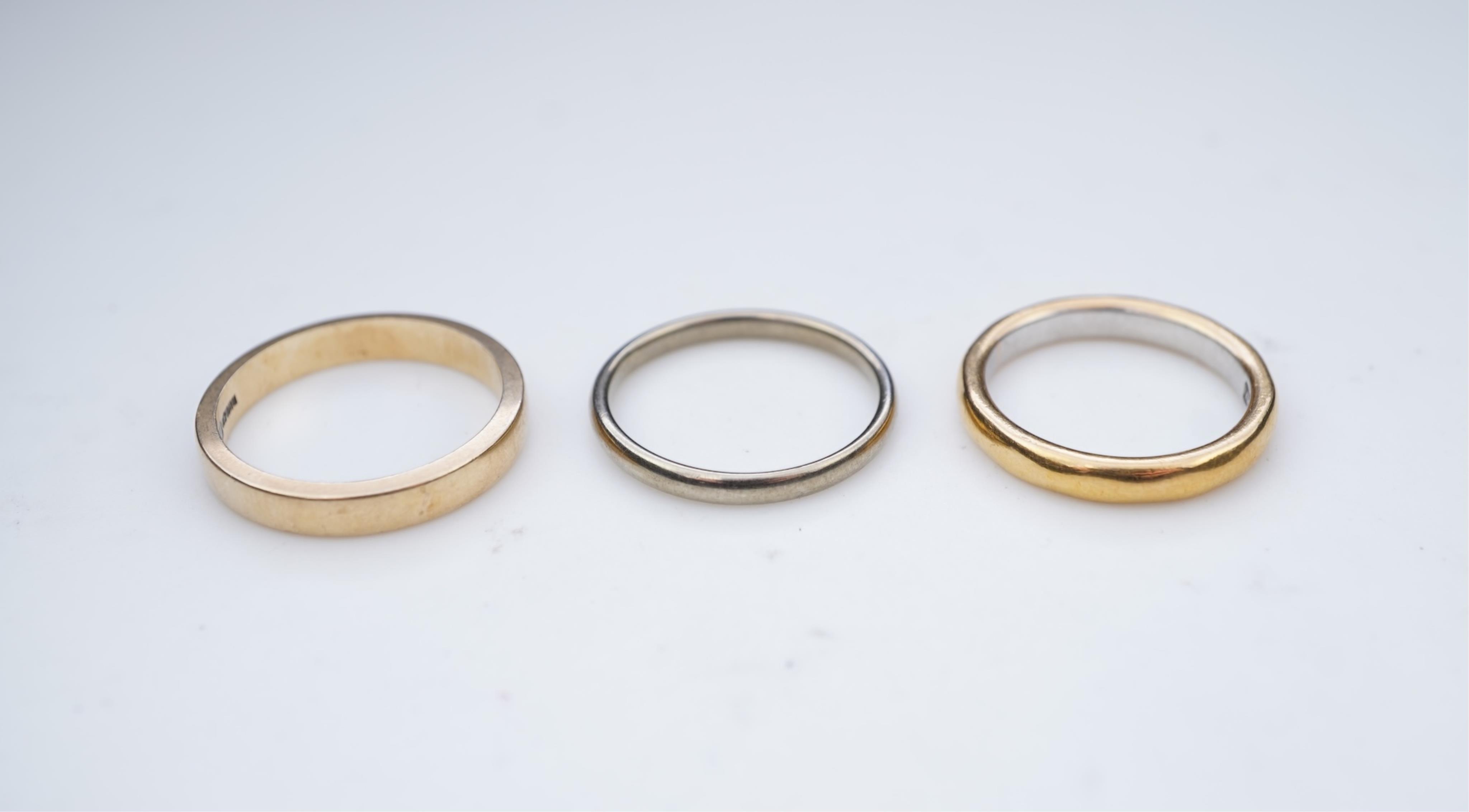 A collection of six gold wedding bands